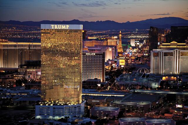 Aerial image of Trump International Hotel Las Vegas, lit up in dusk sky, Nevada. 