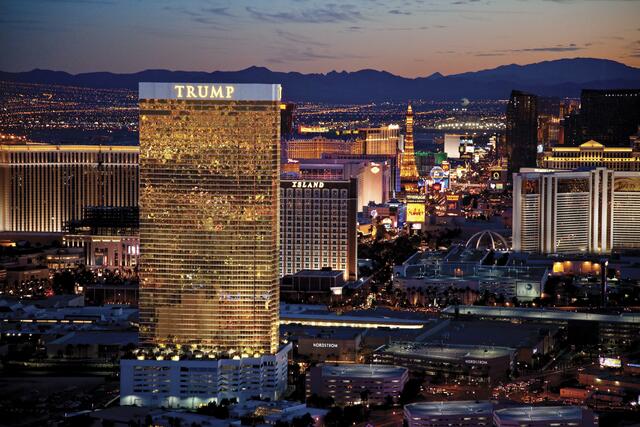 Aerial image of Trump International Hotel Las Vegas, lit up in dusk sky, Nevada. 