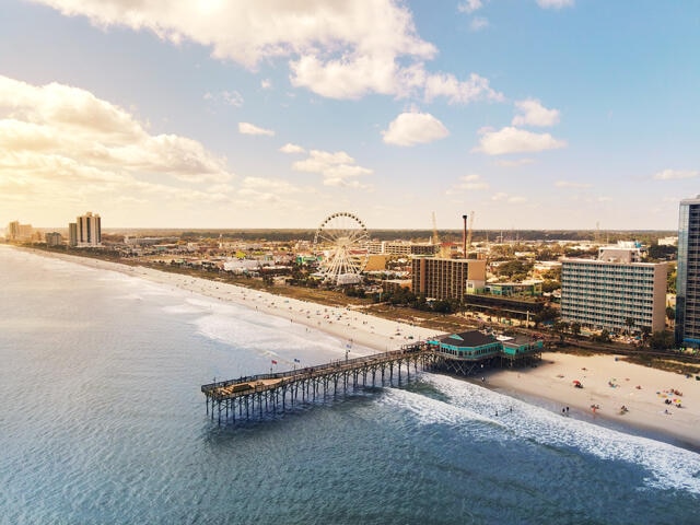Aerial image, cotton candy skies overhead Myrtle Beach, pier and boardwalk, South Carolina. 