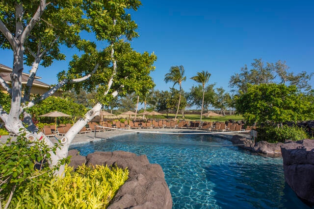 Idyllic tropical pool, volley ball net, Palm trees, blue skies, Kings' Land, a Hilton Grand Vacations Club, Big Island, Hawaii. 
