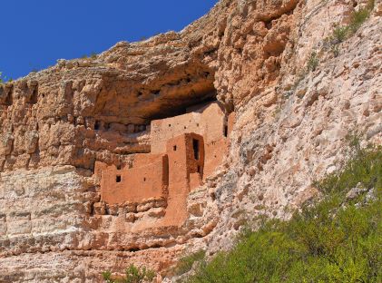 Montezuma Castle, a national monument of an ancient Native American society that built a city into the side of a rock face, near Sedona, Arizona