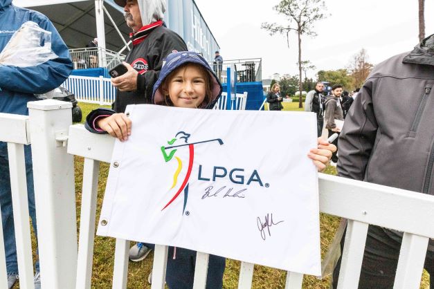 Little girl holding sign at Hilton Grand Vacations Tournament of Champions, Lake Nona Golf & Country Club, Orlando, Florida. 