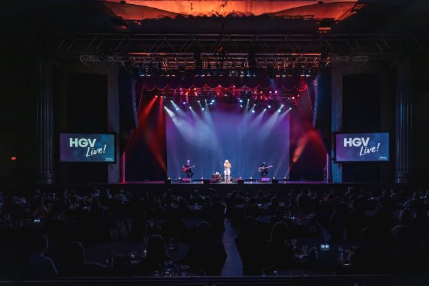 Wide shot, Carly Pearce performing on stage before HGV Live! audience, Hard Rock Orlando, FLorida. 