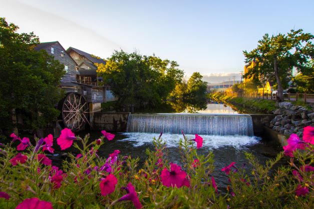The Old Mill, blue skies and bright wildflowers, Pigeon Forge, Tennessee.
