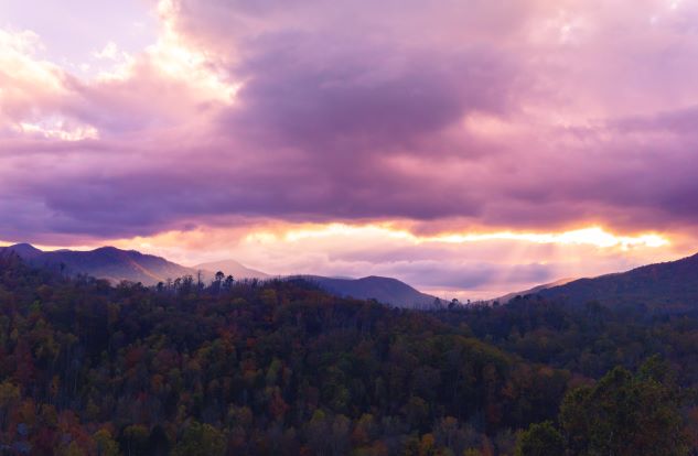Smoky Mountains with purple dusk skies overhead, Gatlinburg, Tennessee. 