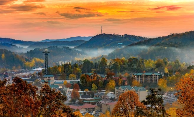 Sunrise over the Gatlinburg, Tennessee, skyline and the Smoky Mountains in fall