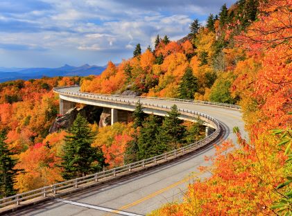 Autumn foliage and the Linn Cove Viaduct, part of the Blue Ridge Parkway, the most visited national park in 2021