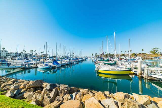 Idyllic boat marina, bright blue water, clear blue skies, Southern California. 