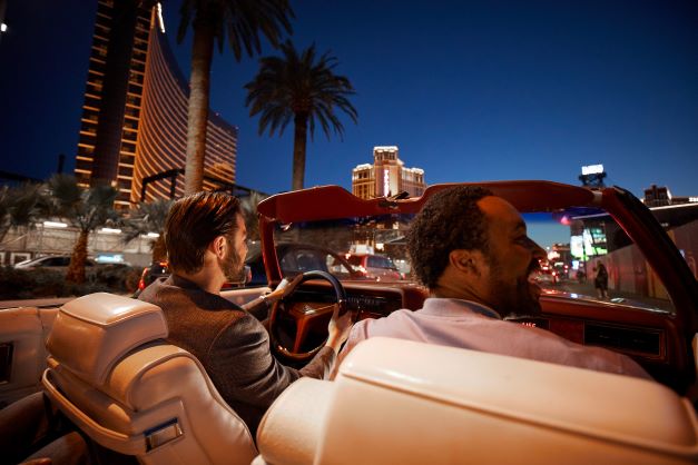 Couple driving convertible, Las Vegas, Nevada. 