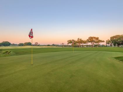 Golf course at sunrise at Mystic Dunes, a Hilton Vacation Club, near Orlando, Florida