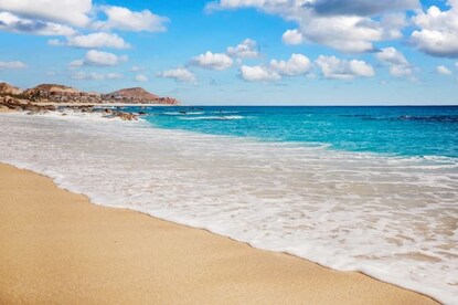 Stunning shoreline, turquoise water washing ashore, Los Cabos, Mexico.