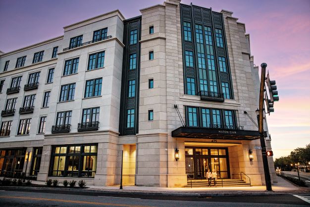 Exterior image, Liberty Place Charleston, a Hilton Club, cotton candy colored skies overhead. 