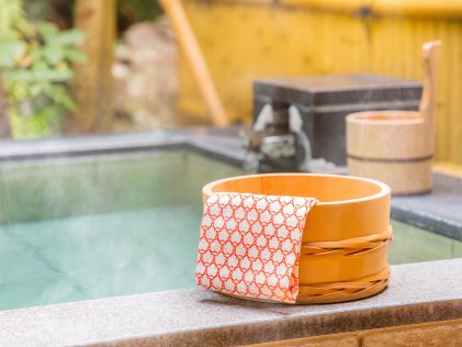 Wooden bucket at bathhouse