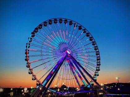 Lit up Ferris wheel at sunset in Branson, Missouri
