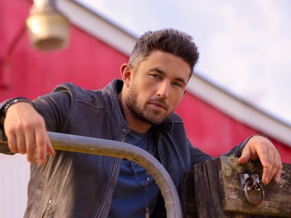 Michael Ray, a Hilton Grand Vacations celebrity Brand Ambassador, in a leather jacket
