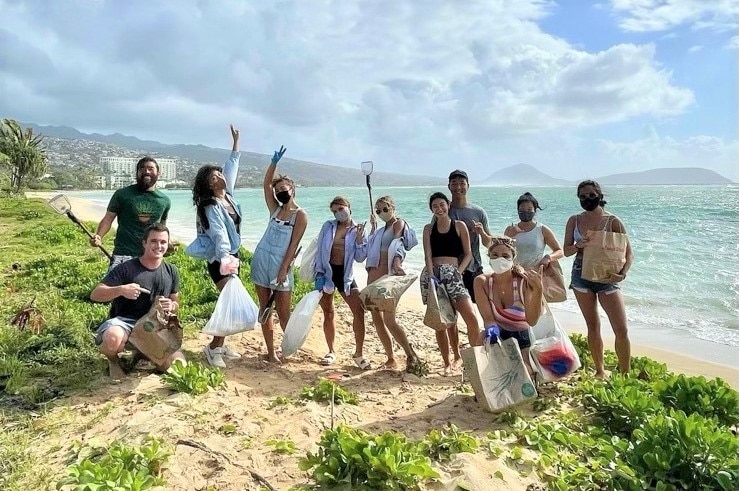 A Hilton Grand Vacations Owner participating at a beach cleanup in Hawaii