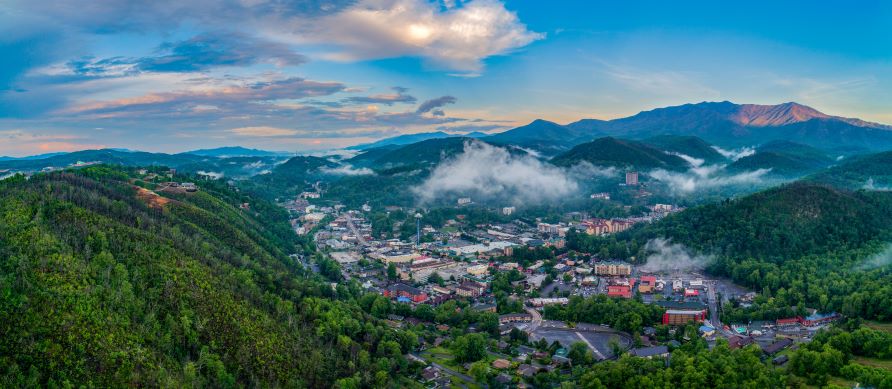 Aerial view, charming mountain town, misty clouds, blue skies, Gatlinburg, Tennessee. 