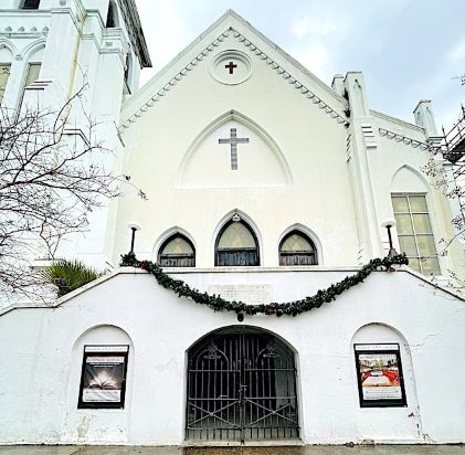 White stucco exterior of Emanuel AME Church, one of the oldest Black churches in the United States, located in Charleston, South Carolina