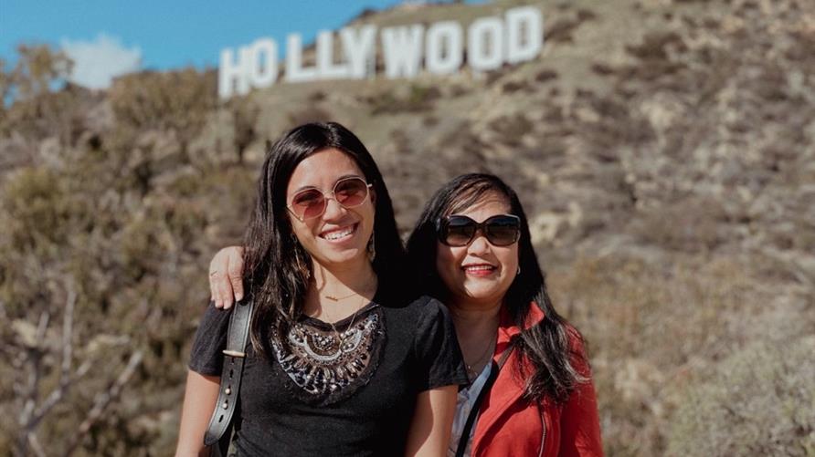 A Hilton Grand Vacations Owner and her mother with the Hollywood sign in the background on their trip to Southern California