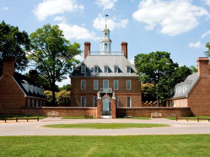 The brick Colonial Governor's Palace in Colonial Williamsburg, Virginia on a sunny day