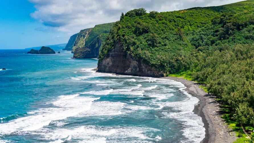 Stunning aerial images, lush green cliffs, turquoise waves crashing, Big Island, Hawaii.  