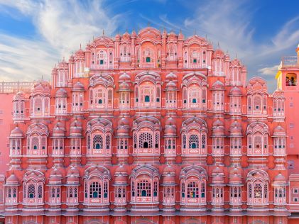 The pink sandstone exterior of Hawa Mahal in Jaipur, India