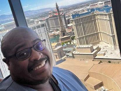 A Hilton Grand Vacations Owner taking a selfie of the Las Vegas Strip