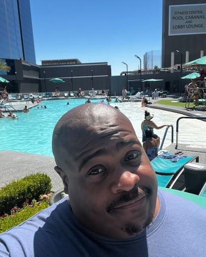 A Hilton Grand Vacations Owner at the pool of Elara, a Hilton Grand Vacations Club in Las Vegas