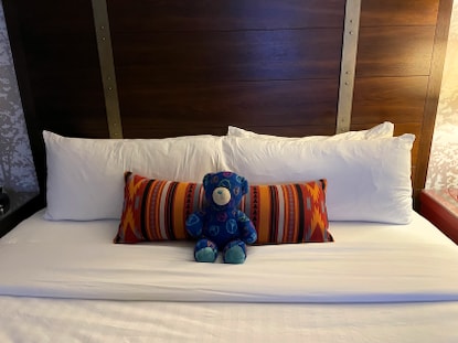 Stuffed bear, neatly made bed, Valdoro Mountain Lodge, a Hilton Grand Vacations Club, Breckenridge, Colorado. 