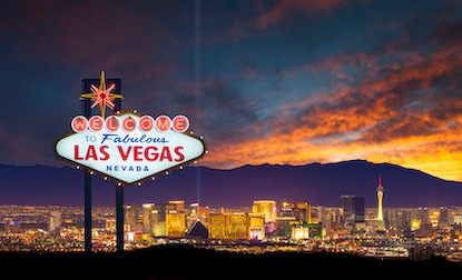 A stunning shot of the world famous Las Vegas sign with the city skyline in the background