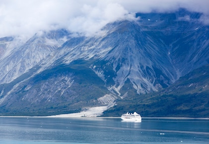 The view of a cruise ship exploring the coast of Glacier Bay National Park, Alaska