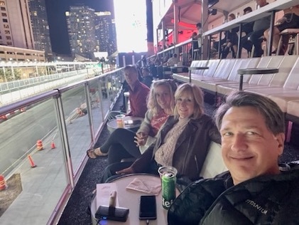 HGV Members and Guests sit in an open-air hospitality lounge at Elara, by Hilton Grand Vacations in Las Vegas, Nevada