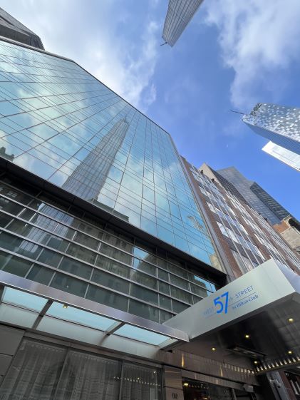 Exterior shot looking up at the skyscrapers surrounding West 57th Street, a Hilton Club in New York