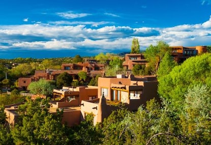 Iconic pueblo-style architecture set against the bright blue sky, Santa Fe, New Mexico.