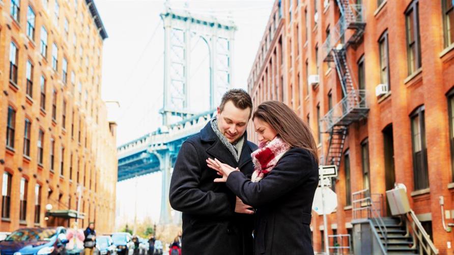 Engagement photo of two Hilton Grand Vacations Members in New York City