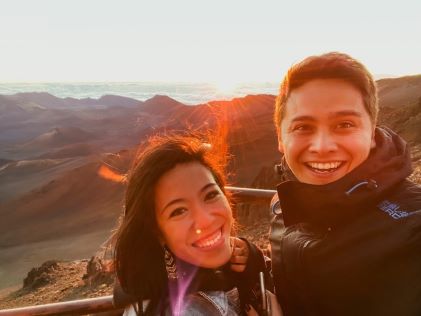 A Hilton Grand Vacations Member at  Haleakala National Park at sunset in Maui, Hawaii