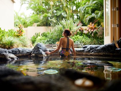 Woman in an outdoor hot springs in Hawaii