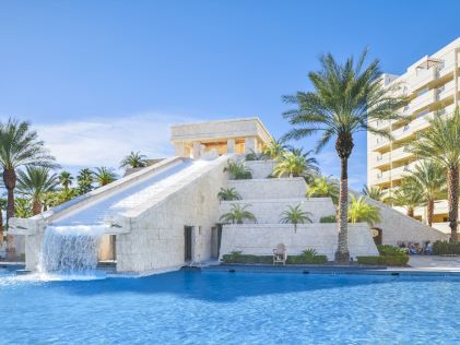 Outdoor pool with pyramid waterfall at Cancun Las Vegas, a Hilton Vacation Club
