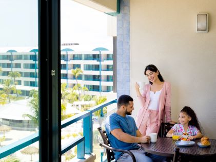 A family enjoys breakfast in a Suite at Royal Palm, a Hilton Vacation Club in Sint Maarten