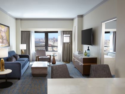 The living room of a Suite at The Residences, a Hilton Club, one of Hilton Grand Vacations' New York timeshares