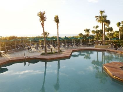 Palm trees and pool at Eagle's Nest Beach Resort in Marco Island, Florida