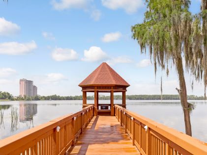 A wooden walkway with a gazebo at Grand Beach, a Hilton Vacation Club in Orlando, Florida