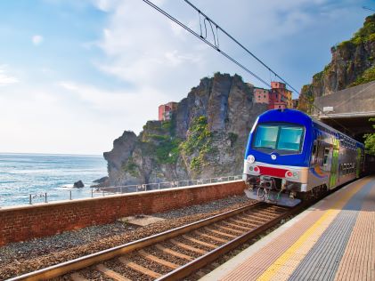 Train exiting a tunnel in Cinque Terre, Italy