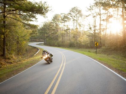 A motorcyclist drives through rural Florida
