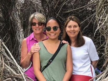 Two Hilton Grand Vacations Members on a getaway with family