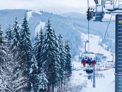 People on a ski lift near Park City, Utah on a snowy day
