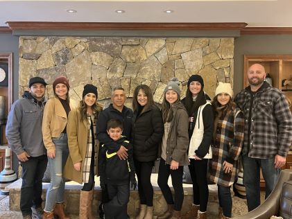A Hilton Grand Vacations Member and her extended family at Valdoro Mountain Lodge, a Hilton Grand Vacations Club in Breckenridge, Colorado