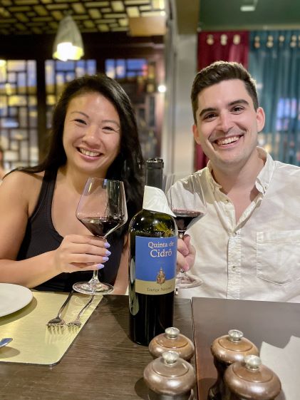 A Hilton Grand Vacations Member and her friend enjoying dinner in Algarve, Portugal