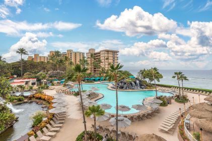 Beautiful aerial image, Hilton Vacation Club Ka’anapali Beach pool, shoreline in distance, Maui, Hawaii. 