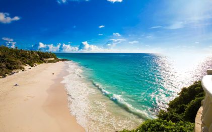 Idyllic coastline, golden sand beach, turquoise waters, clear blue sky, St. Philip, Barbados.
